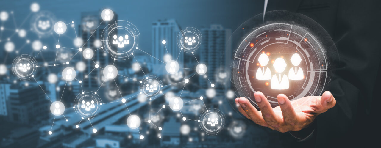 Social Networking Technology Concept, Person Hand Holding VR Screen Human Icon With Blue Bokeh Background, Mixed Media, Social Network Interface.